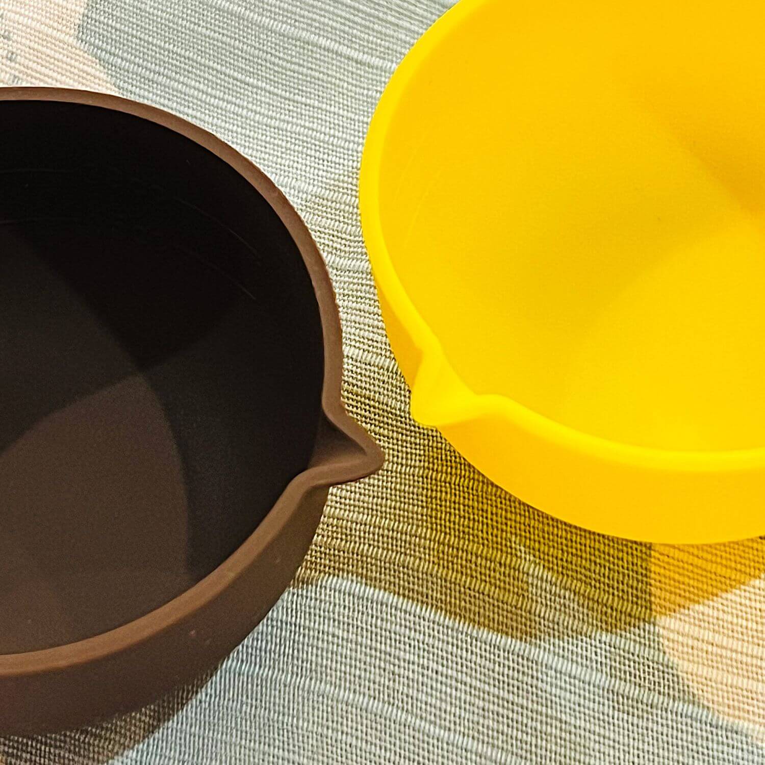 close up yellow brown silicone sauce cups