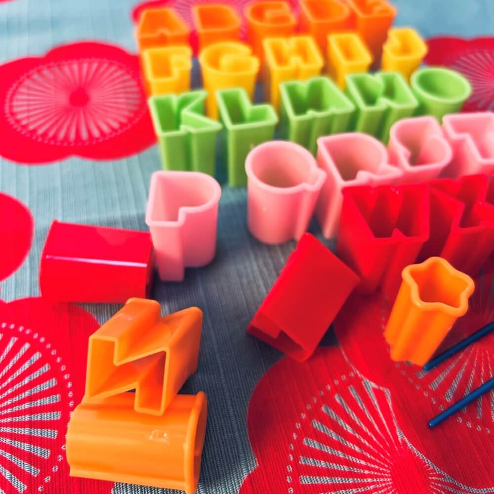 detailed closeup alphabet shaped food cutters