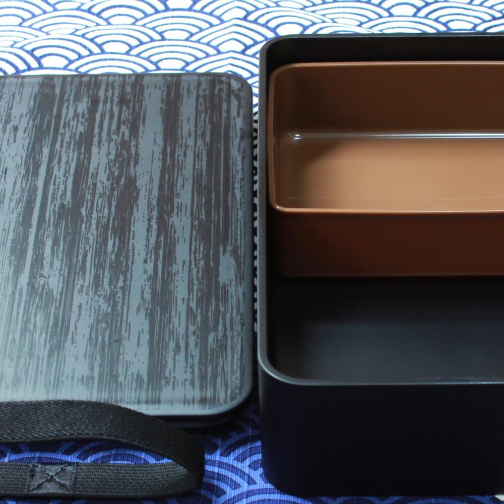 divider inside charcoal black bento box