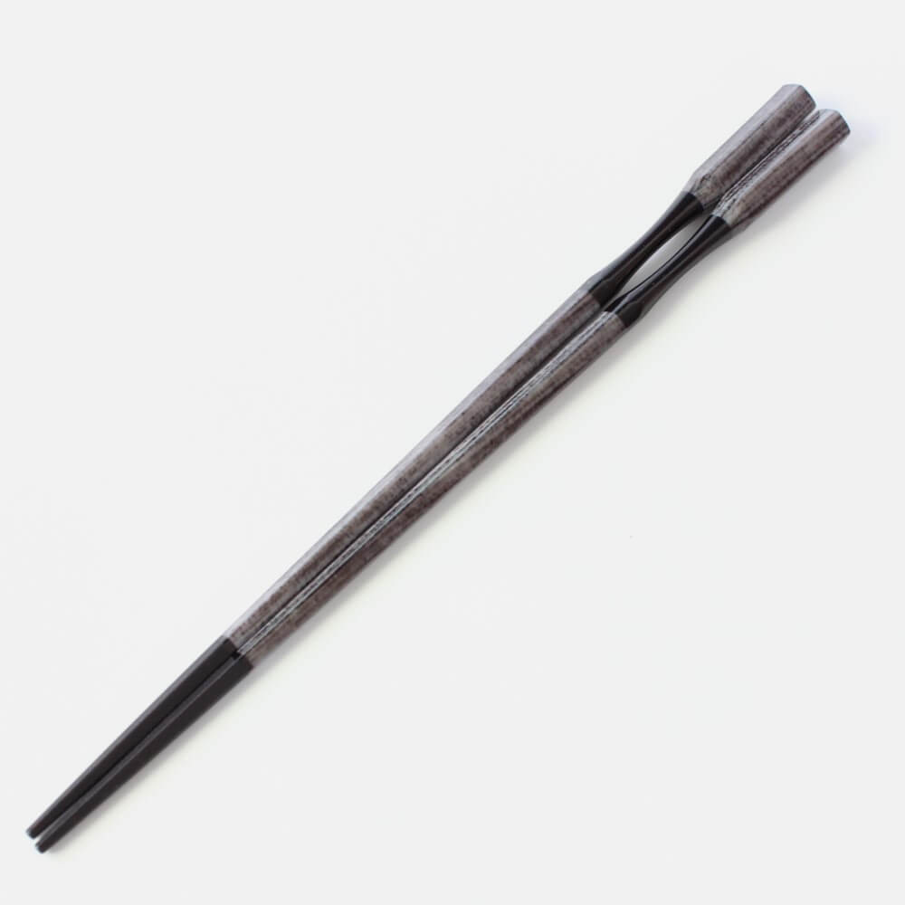 full length of antique grey resin chopsticks