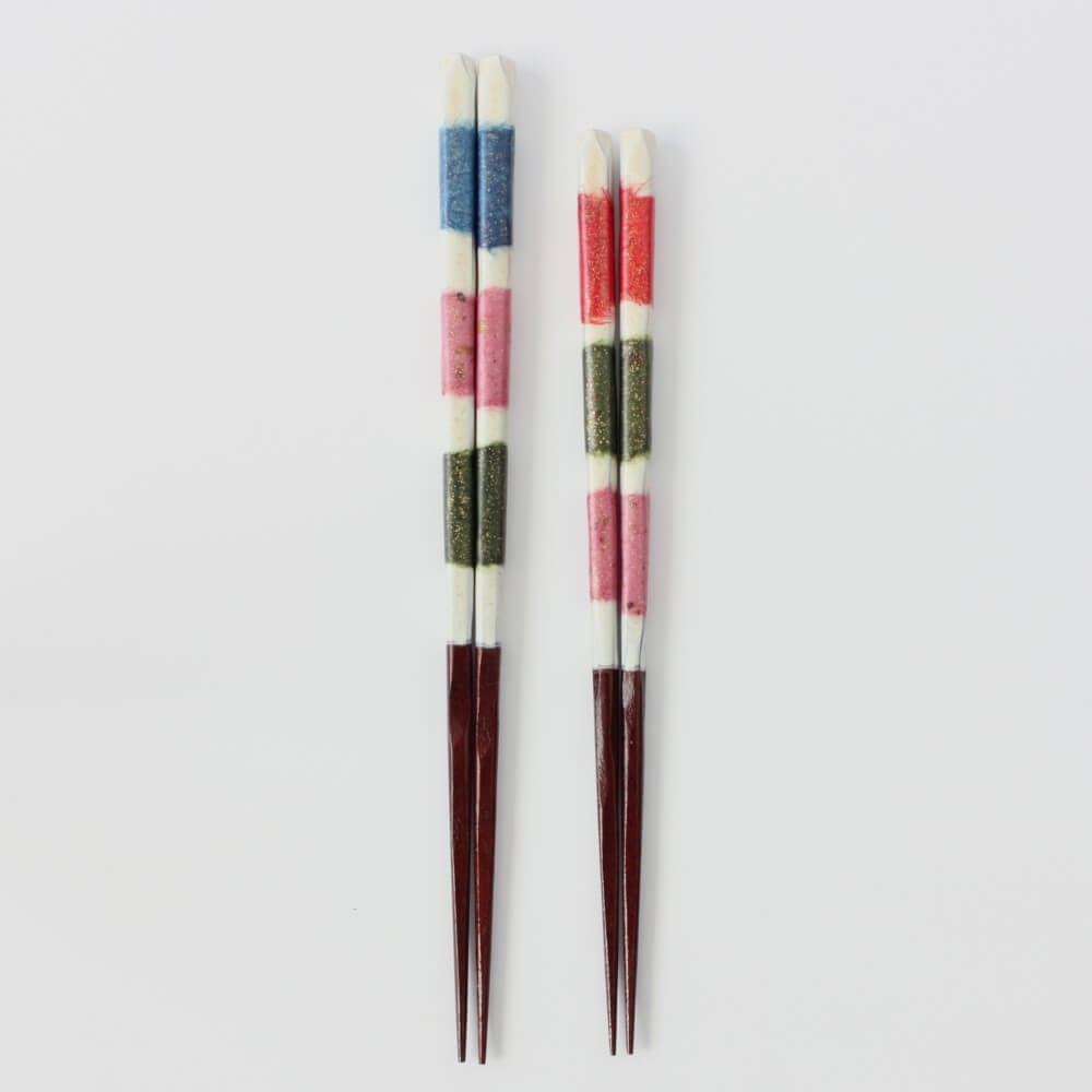 full length of yuushin chopsticks from issou with vibrant colours on handles