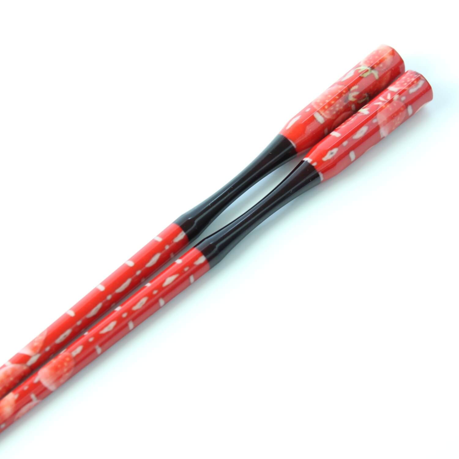 strawberry red resin chopsticks close up  curved handles