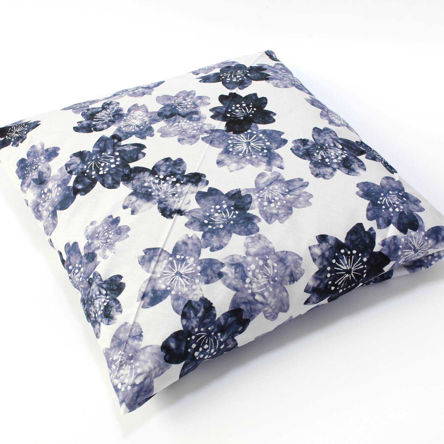 cushion wrapped in indigo sakura furoshiki