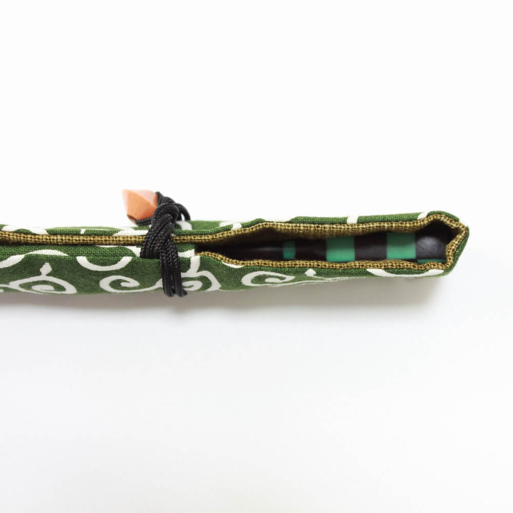 karakusa green fabric case closed with chopsticks inside
