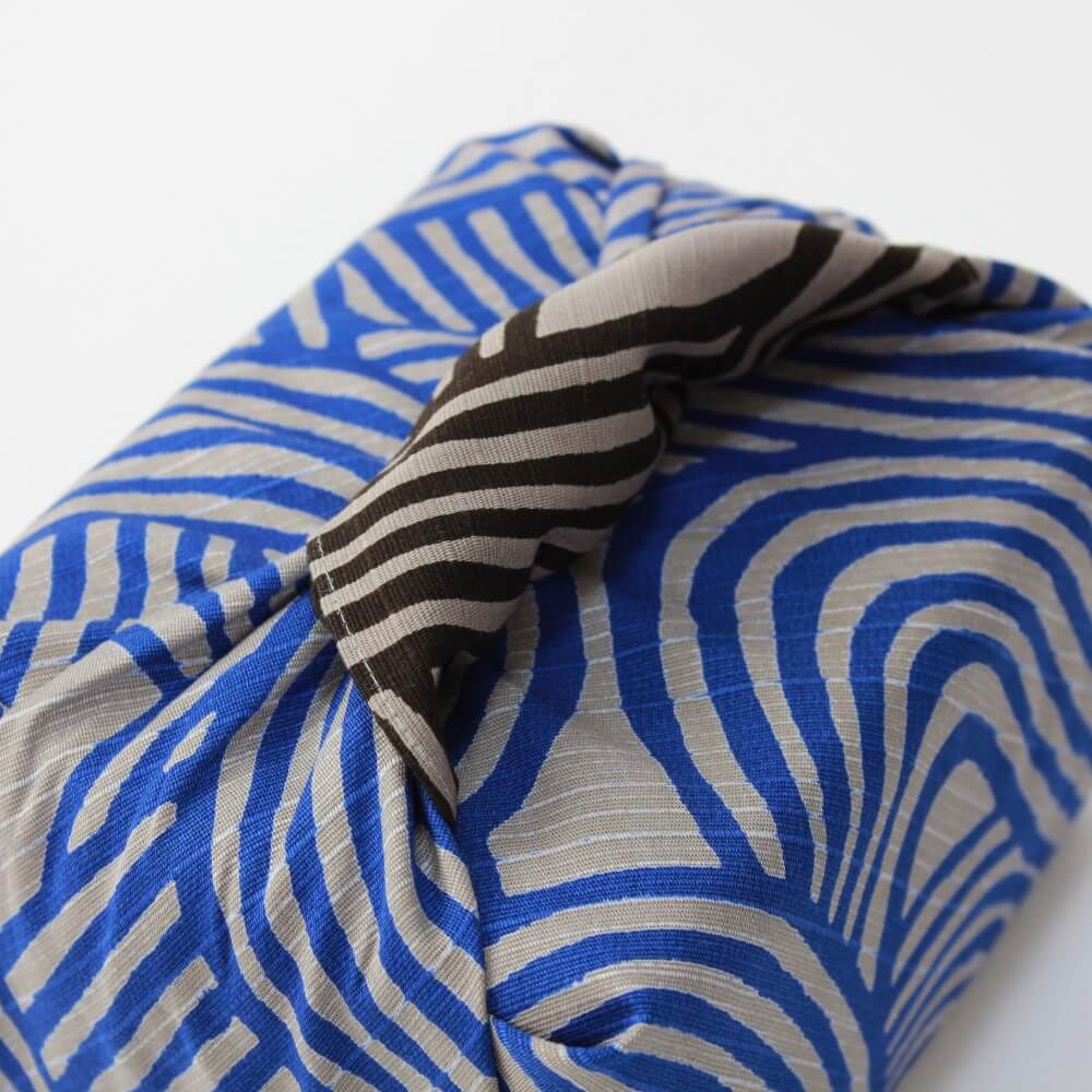 knot covered bento box wrapped with furoshiki