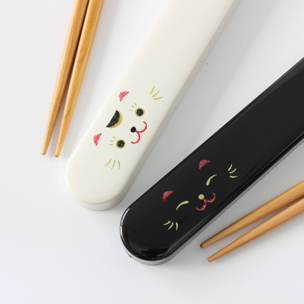 maneki cat white and black chopsticks case close up showing the design