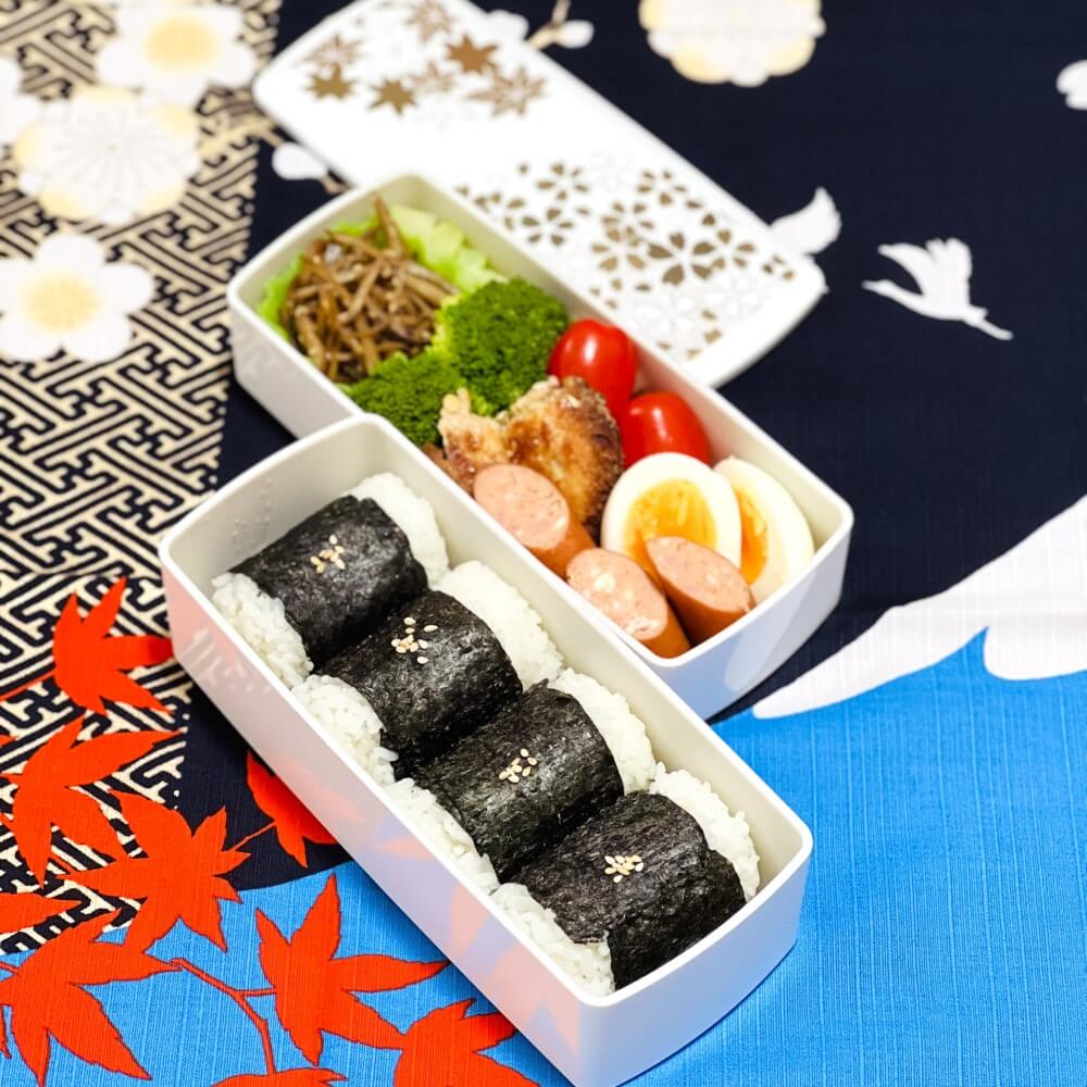 onigiri bento prepared in white hanamaru bento box