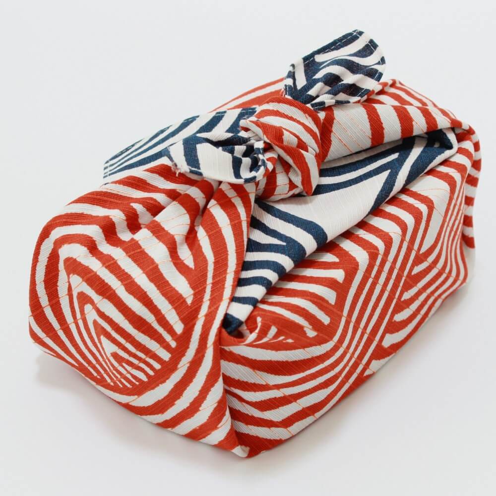 orange blue furoshiki wrapped bento box angled positionorange blue furoshiki wrapped bento box angled position