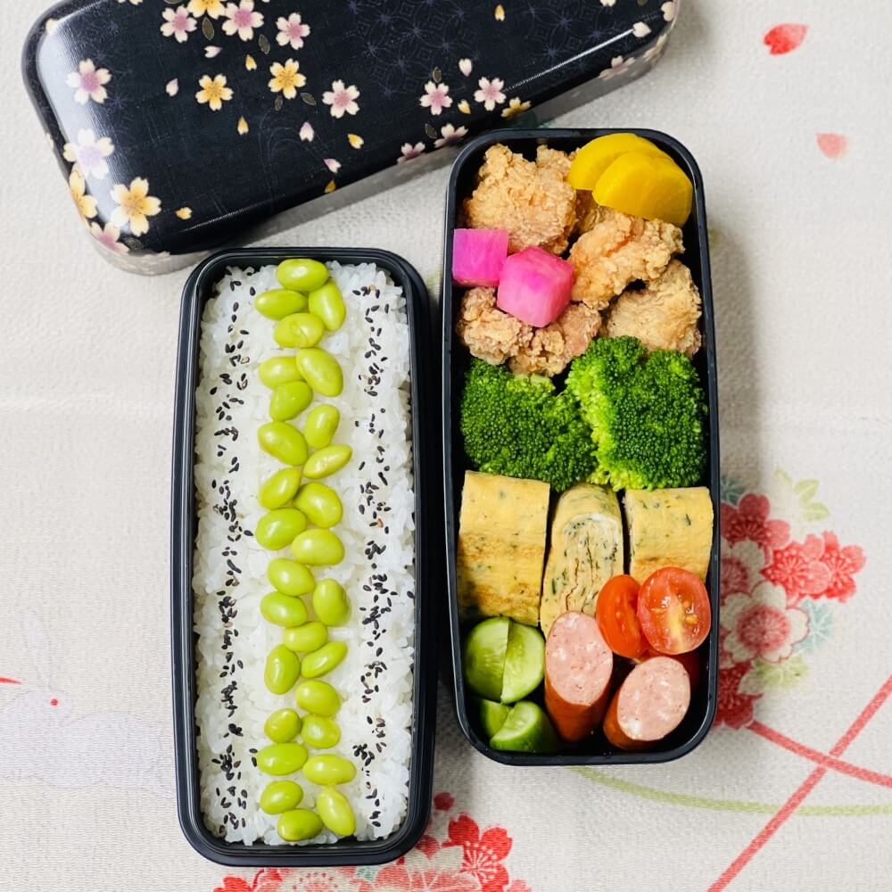 overhead shot karaage chicken bento in ryusui sakura black bento box