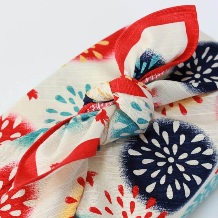 close up photo of tied knot of furoshiki wrapped bento box