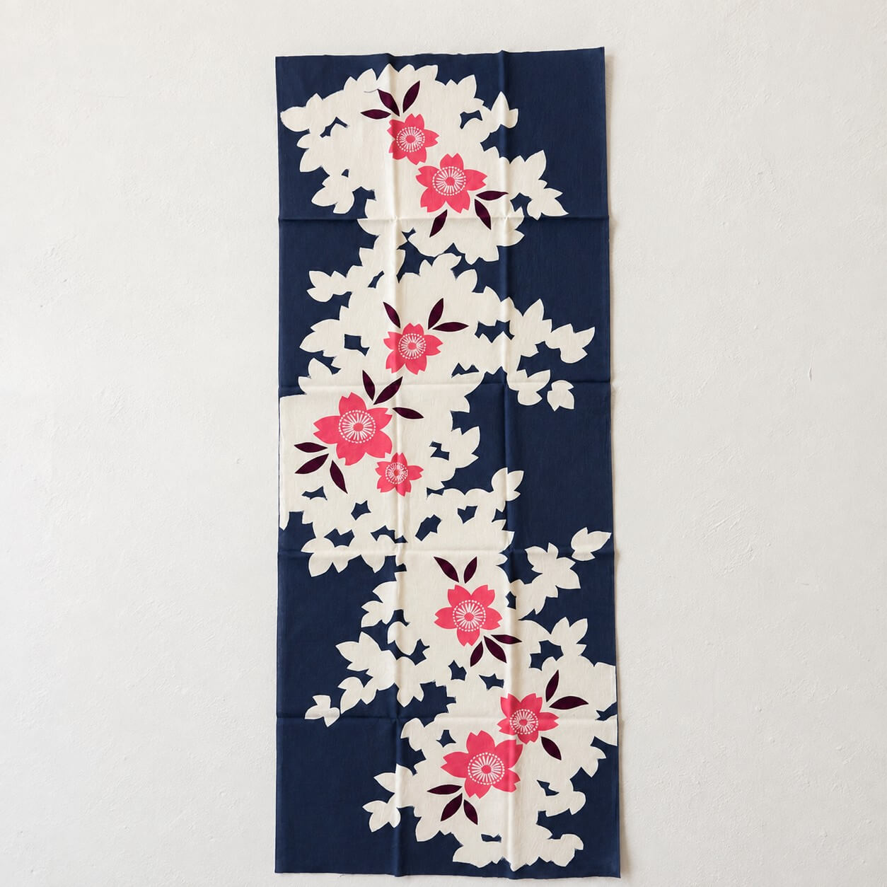 sakura blossomson a dark blue backdrop tenugui