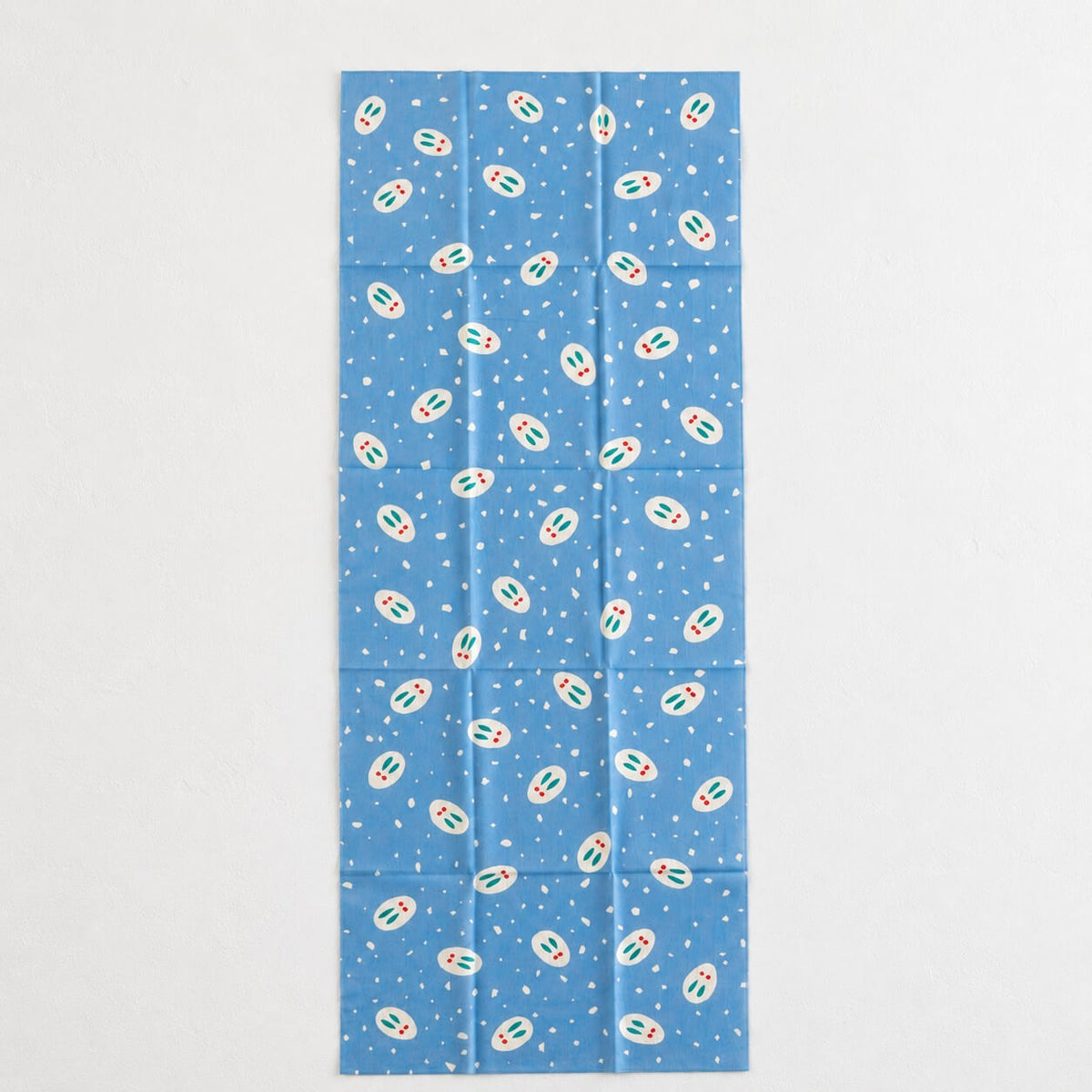 tenugui with snow rabbits and snow flakes on a light blue background