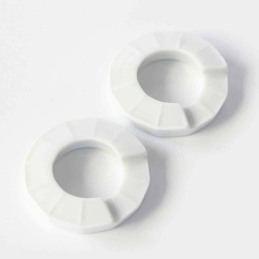 close up of ring shaped chopsticks rests