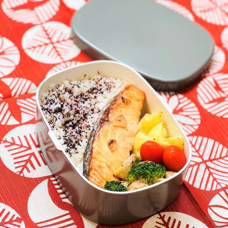 salmon bento in one touch grey bento box on red furoshiki