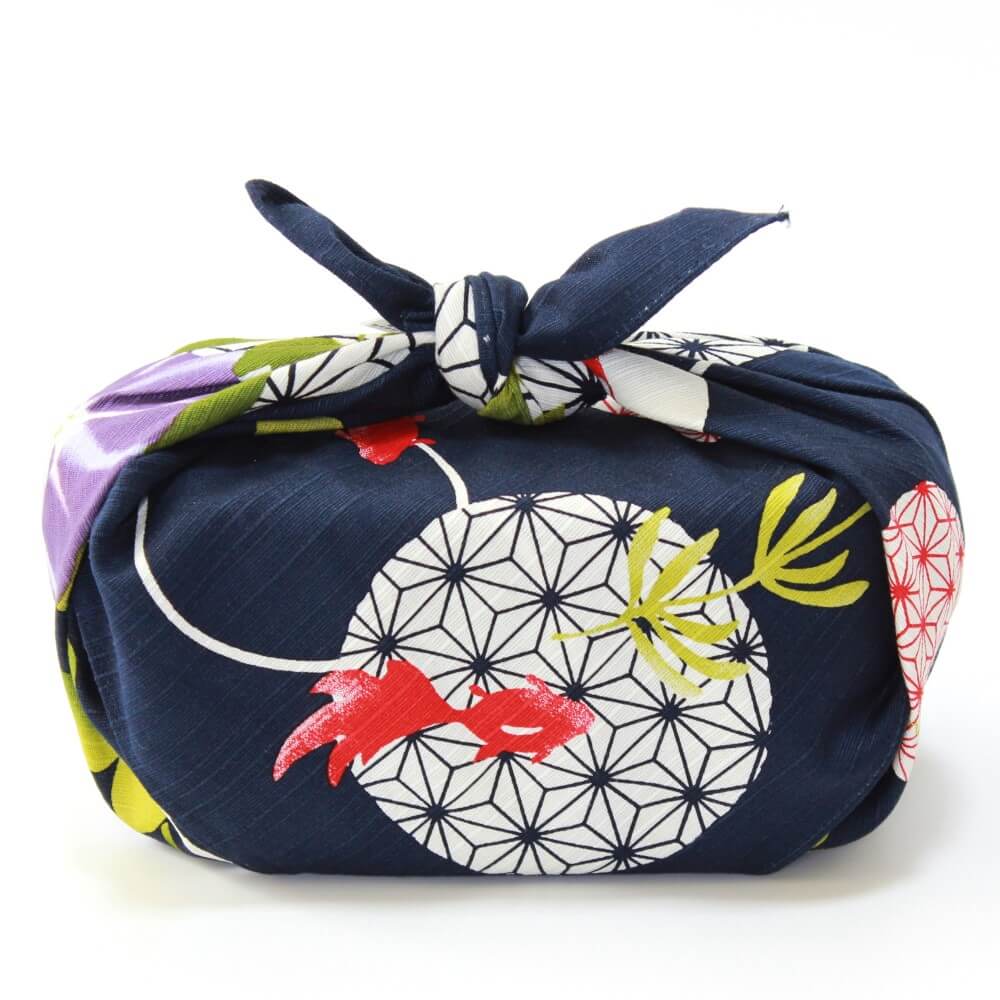 side profile bento wrapped in asanoha goldfish furoshiki