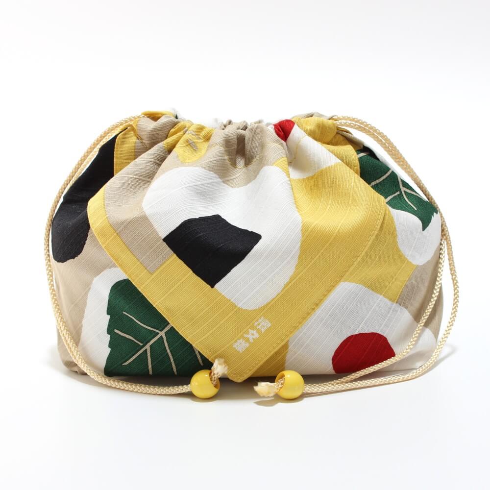 side profile of hamamonyo onigiri tsutsumi yellow bento lunch bag