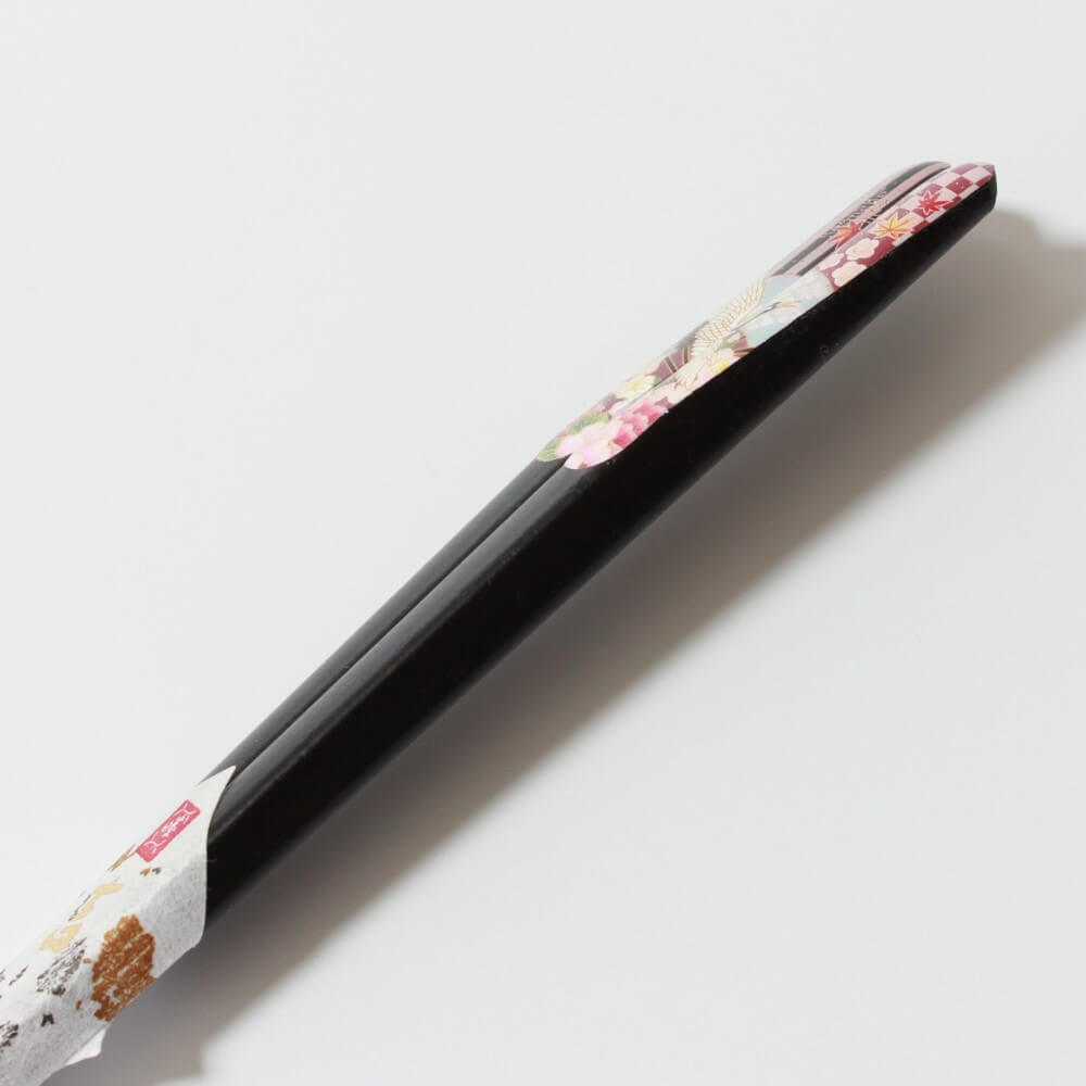 side profile showing sloped handles japanesque crane chopsticks