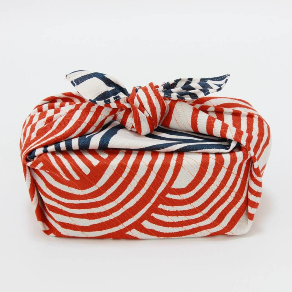 side view blue orange knot furoshiki wrapping bento box