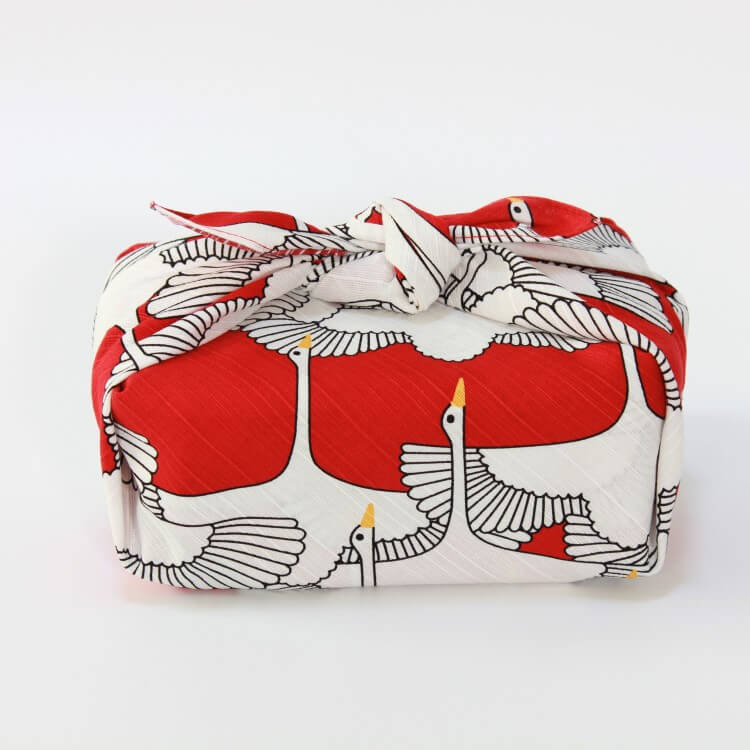 side view of the celebration crane red furoshiki wrapped bento box