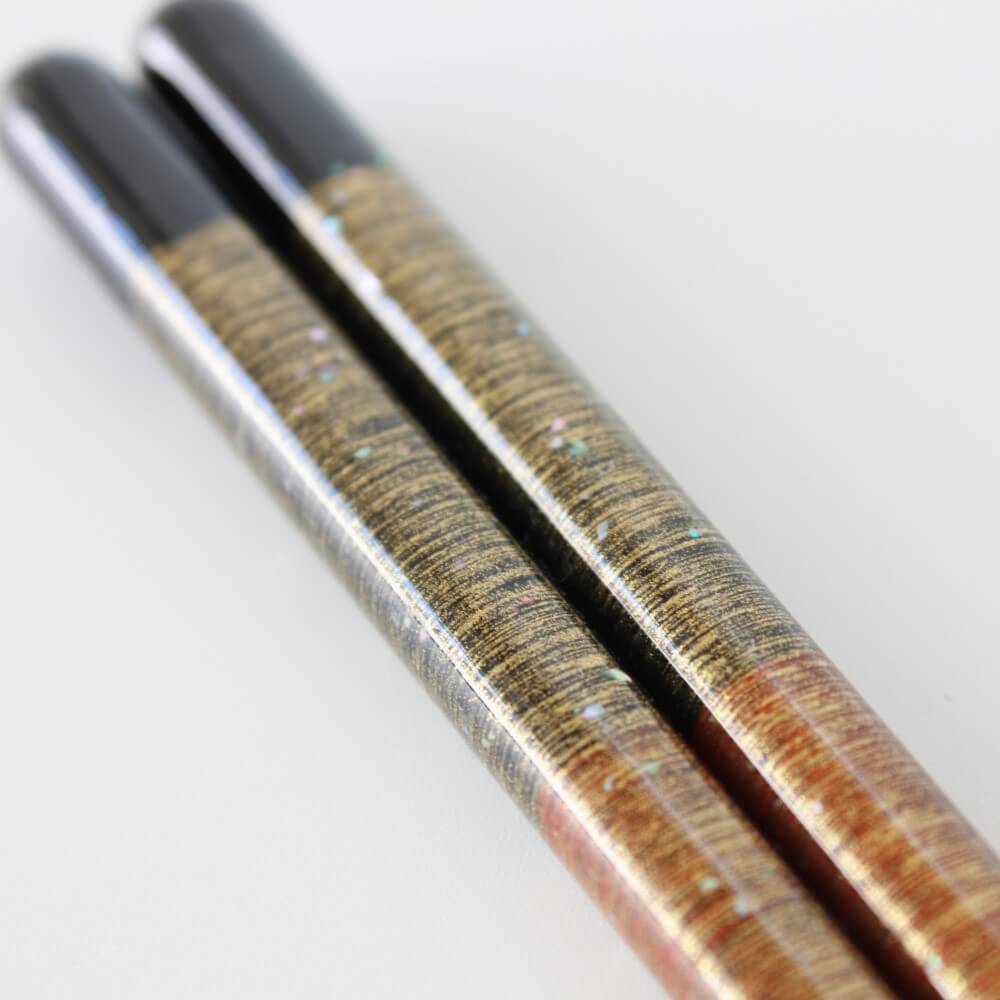 super close up of handles showing contours on mutsuki red chopsticks