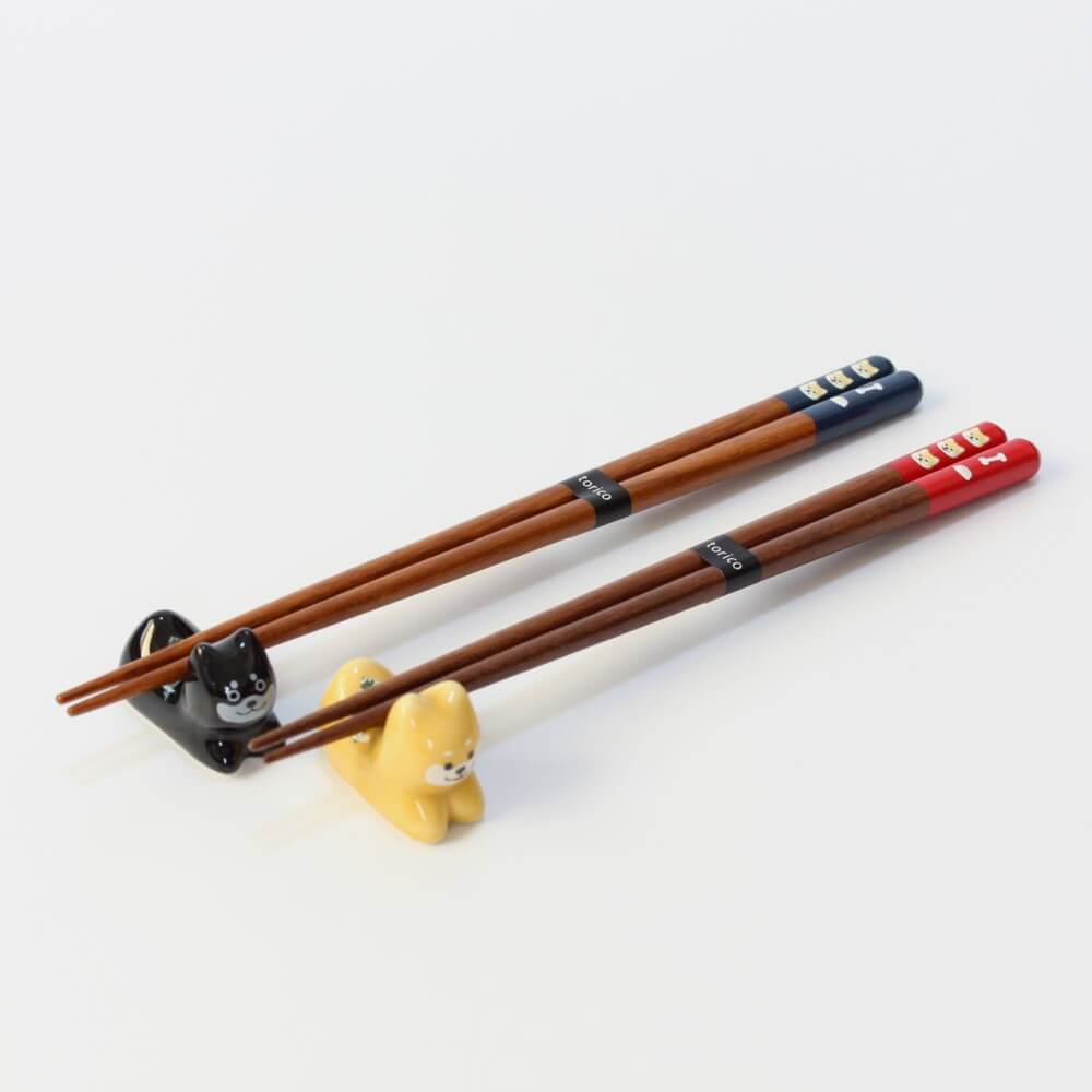 two tenmaru shiba inu chopsticks on shiba inu rests