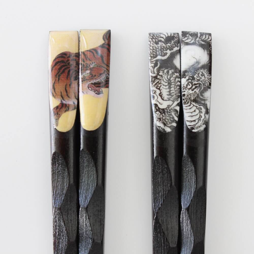 tenpyo tiger dragon emblems on chopsticks close up