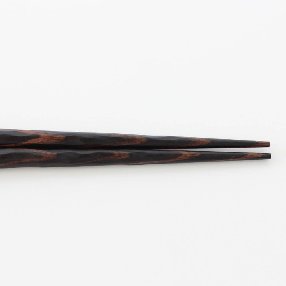 close up tips of thick cut Japanese birch wood chopsticks 