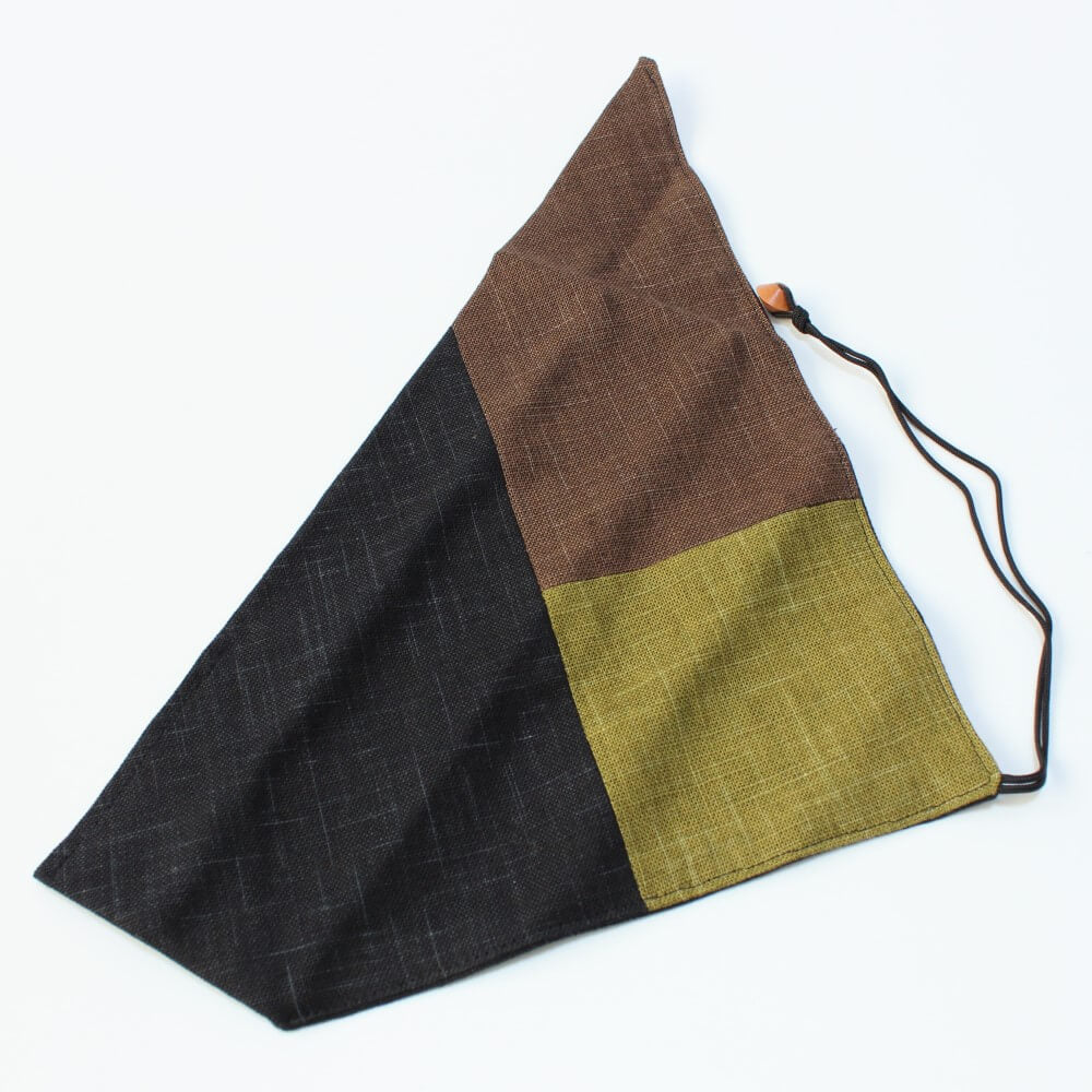 top side of chopsticks case showing brown, green and black colours