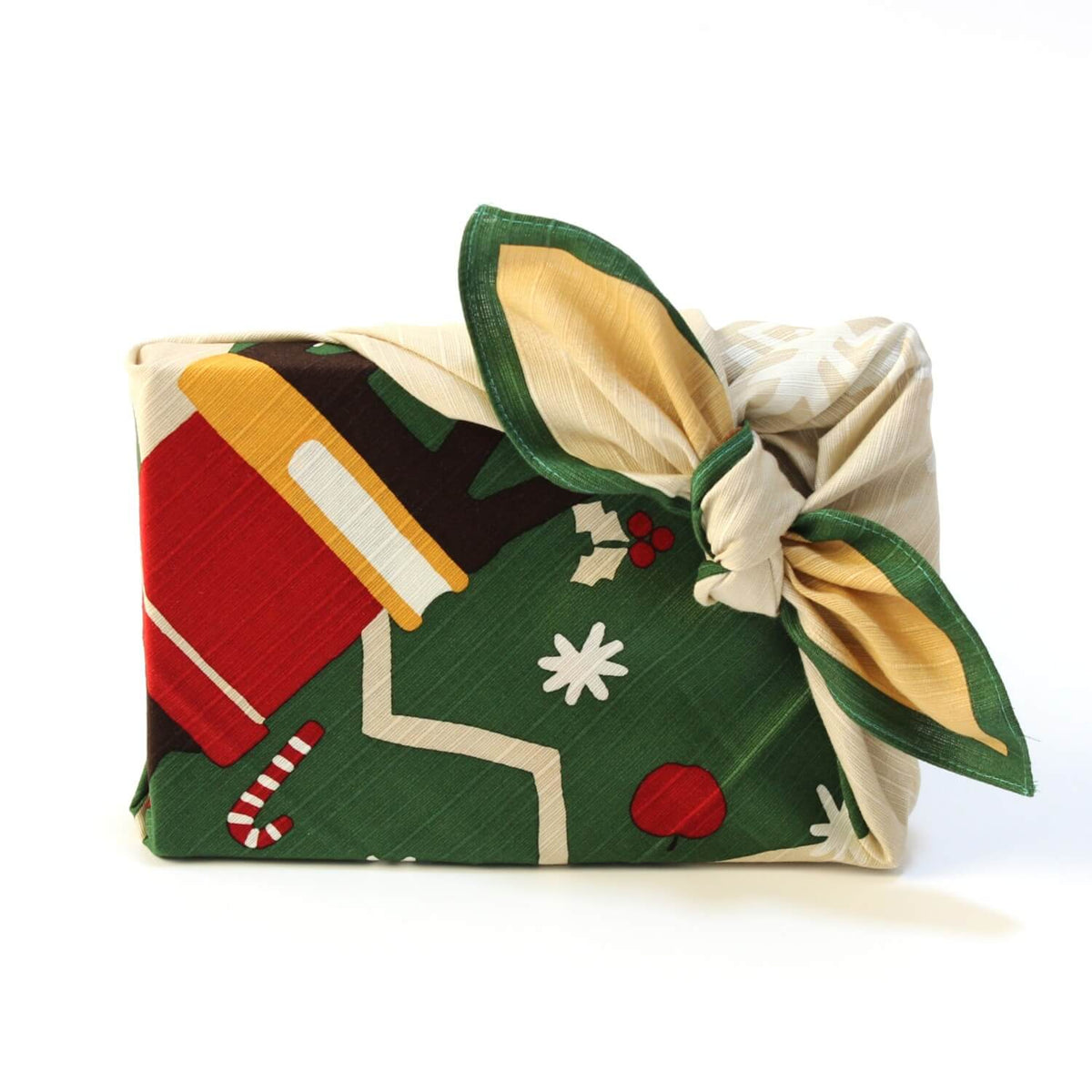 gift wrapped in christmas themed furoshiki with knot at the corner