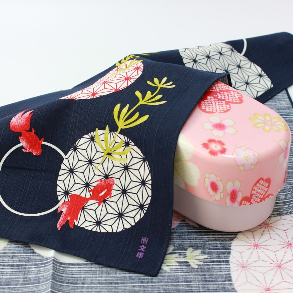 yume sakura bento box covered by asanoha goldfish furoshiki