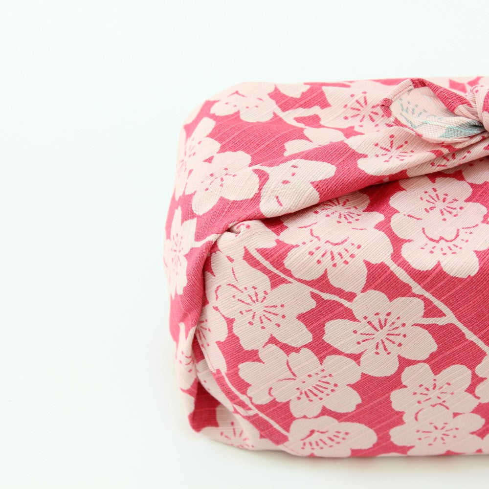Japanese furoshiki with pink and blue background with white sakura flower design from Majime Life