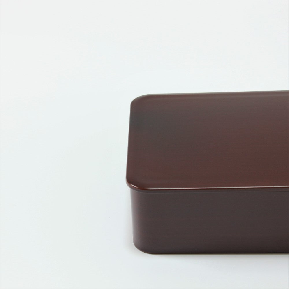 Closeup view showing the wooden hue colour of the tochi bento lunch box from Majime life