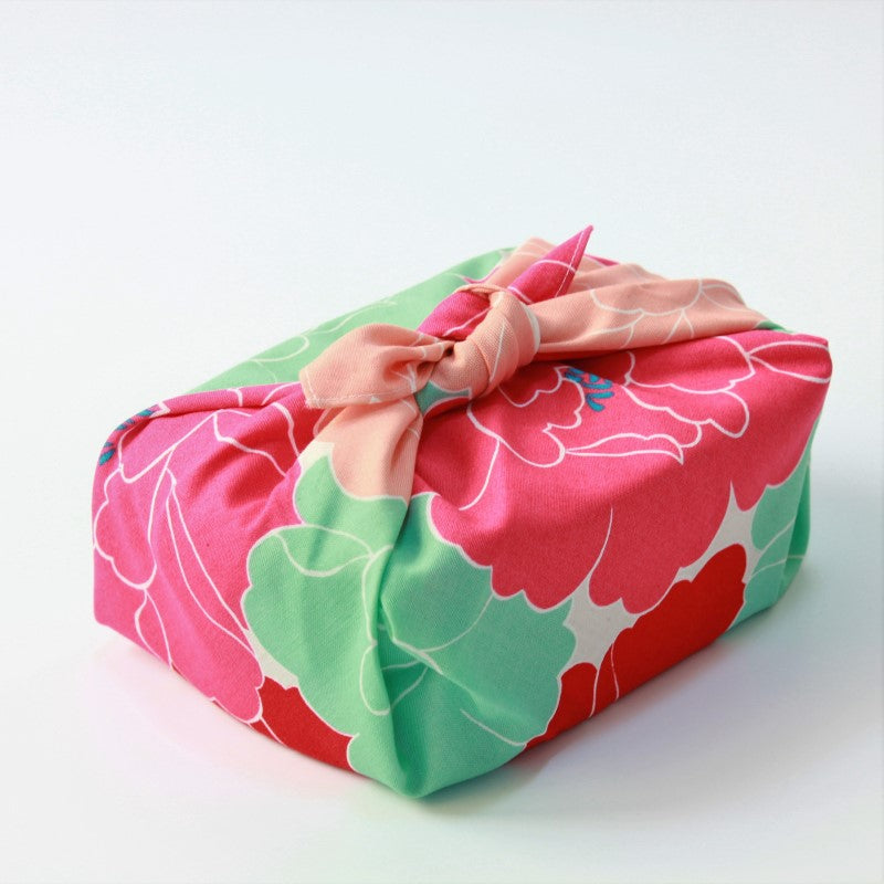 Side view of Hime Musubi Peony Red Furoshiki Japanese wrapping cloth wrapped around a bento box