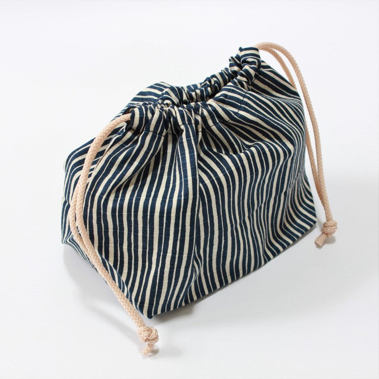 side angled view of the Tokusa Stripes Navy Bento lunch bag at Majime Life