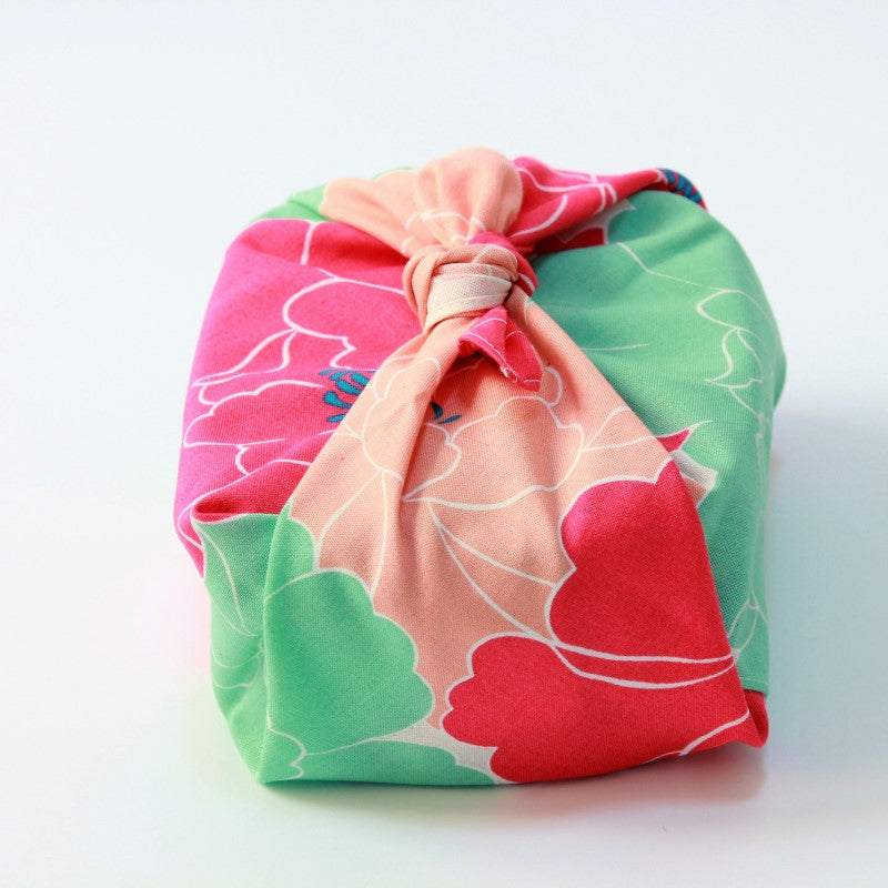 front view of a bento box wrapped in the hime musubi peony red furoshiki