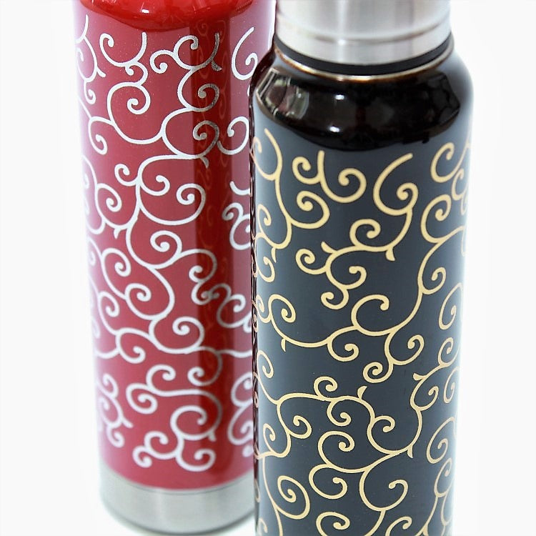 Close up shot showing karakusa design on the vermillion and black umbrella bottles