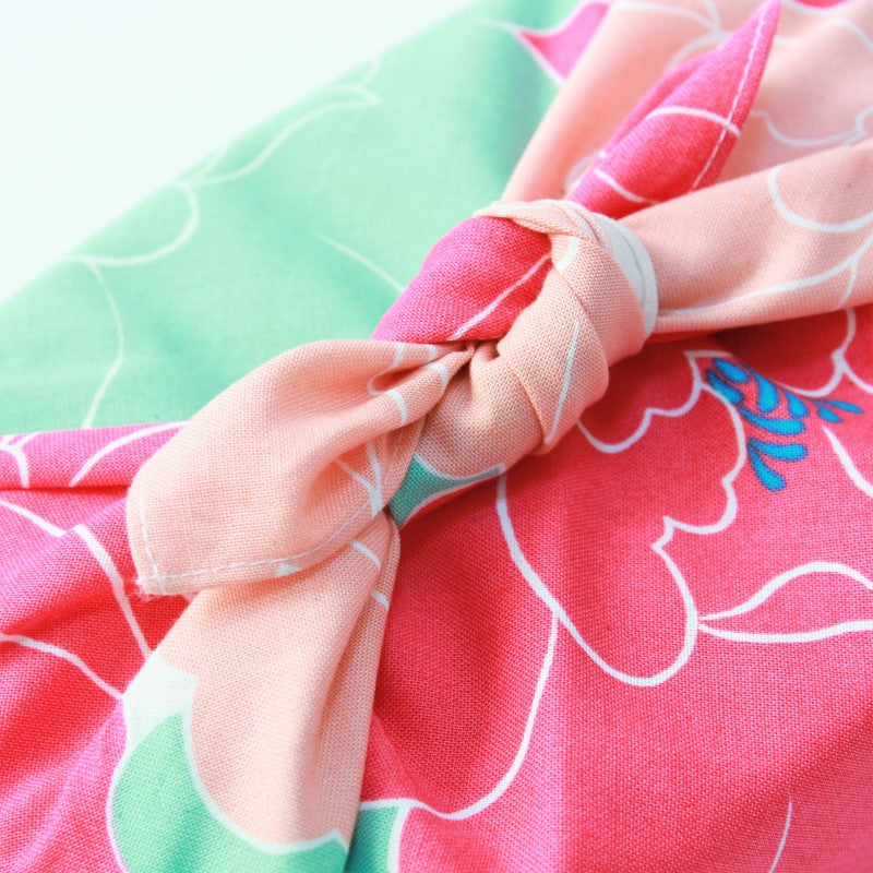 Close up view showing the knot and fabric of a wrapped bento box