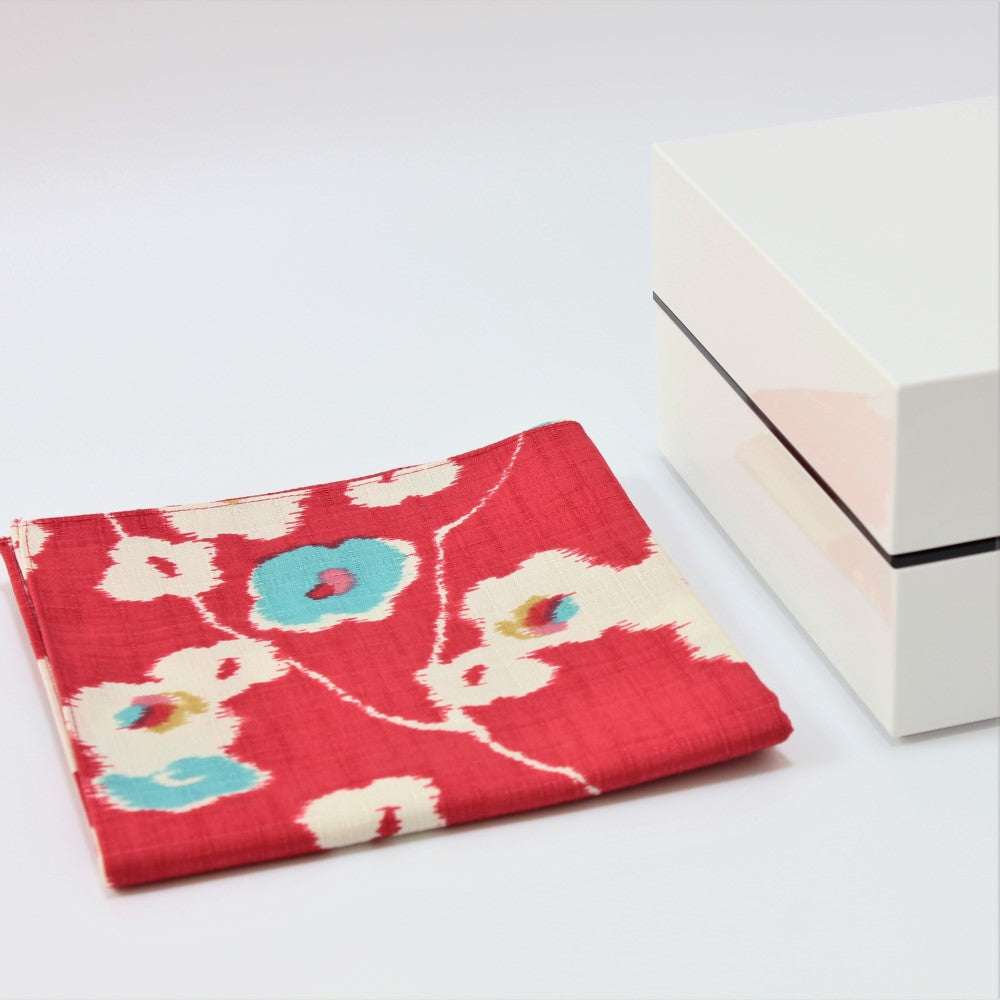 Folded furoshiki next to the Shirayuki 2 tier picnic bento box from Majime Life 