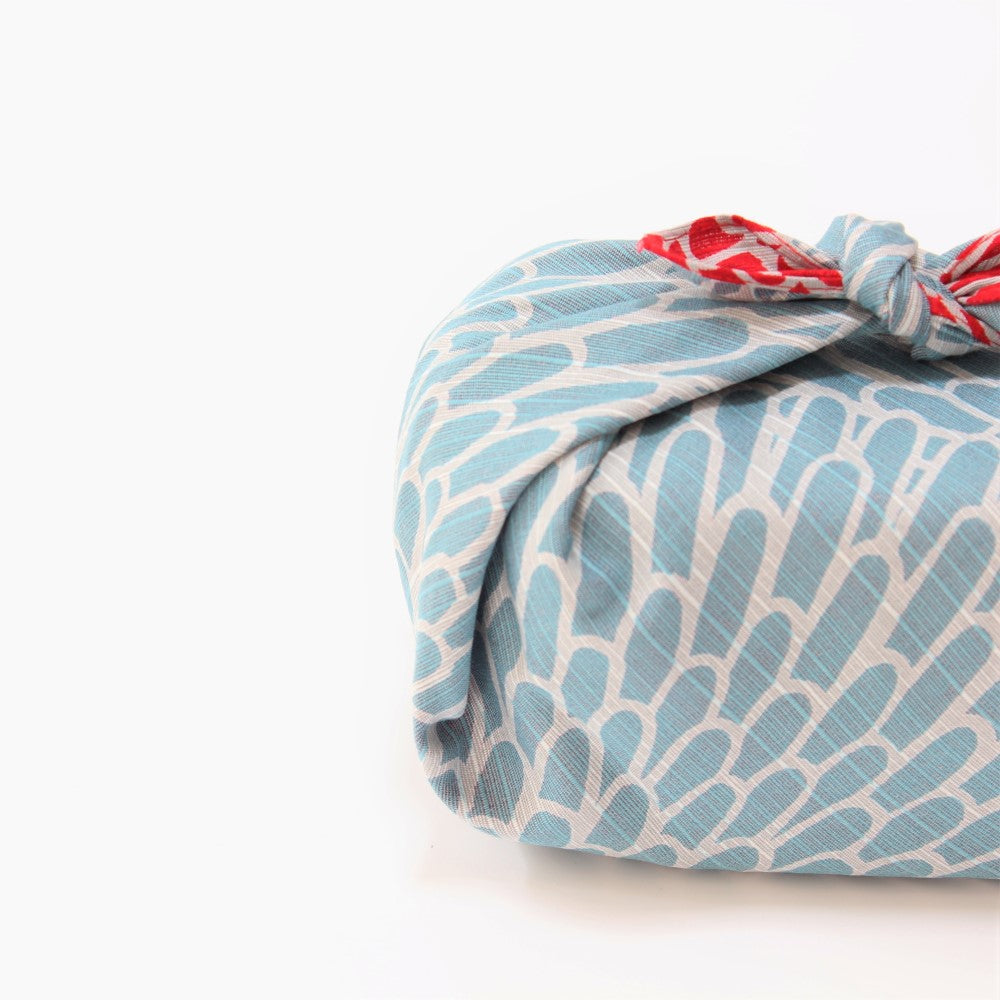 Double sided furoshiki provides two options of uses.  shot showing blue side of the furoshiki from Majime Life. 