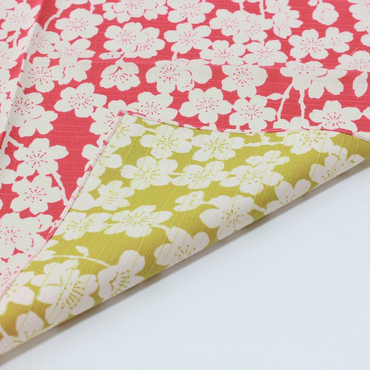 picture showing both sides of the double sided isa monyo sakura pink and light green furoshiki