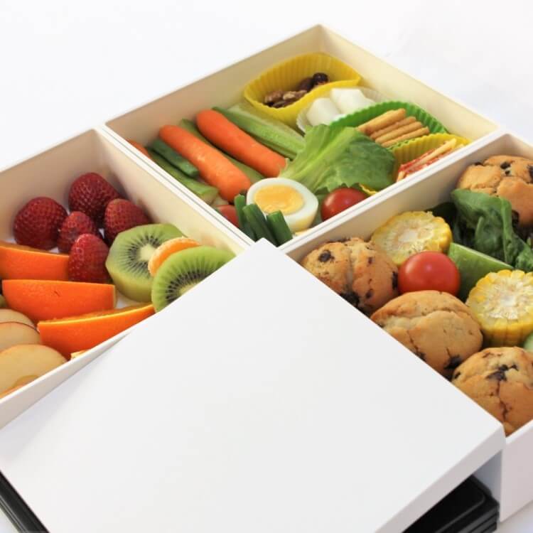 Muffins, fruits, vegetables and other food inside the yukimi 3 tier white picnic bento box