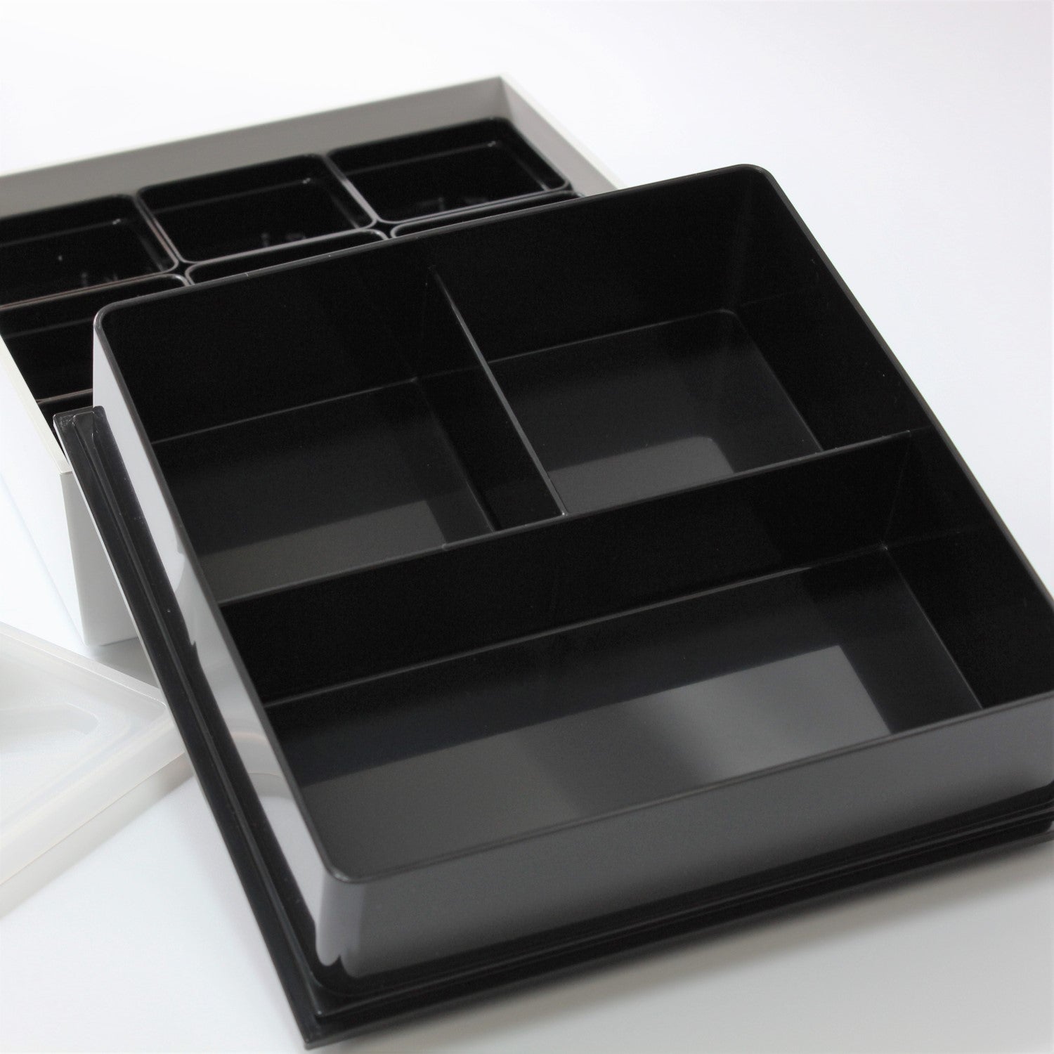 Close up showing the 3 sections of the upper compartment of the Shirayuki picnic bento box