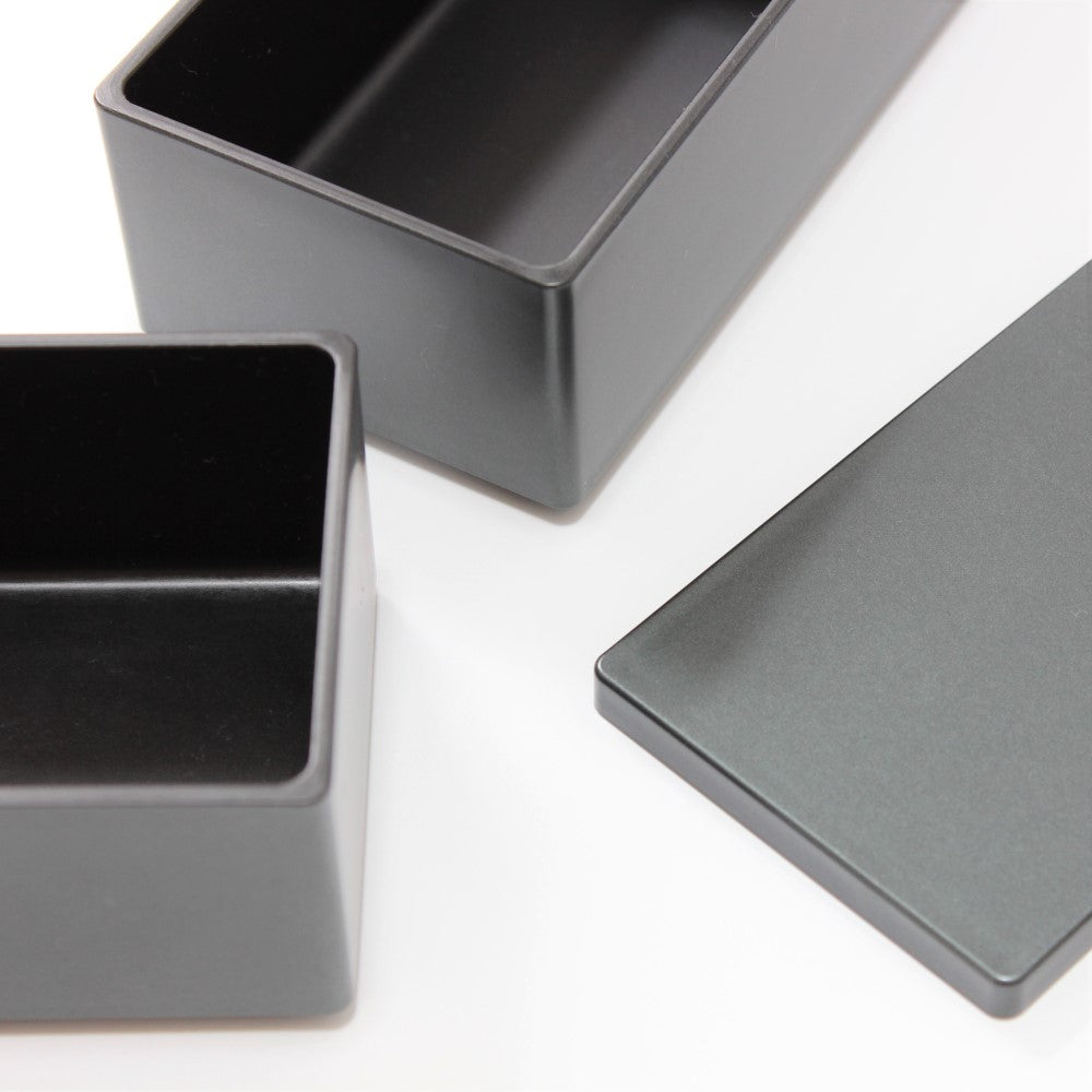 Close up showing the metallic black surface of this bento box.