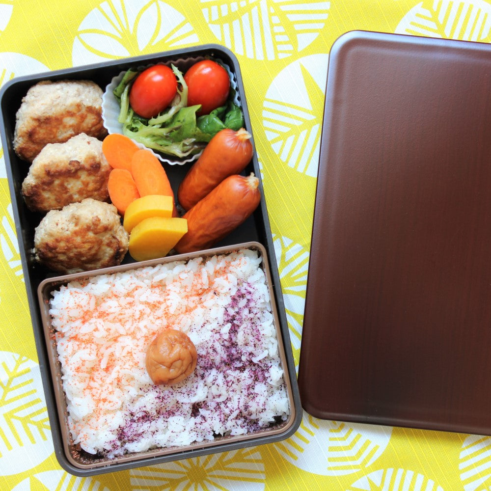 Top view showing a beautiful Japanese lunch in this bento box