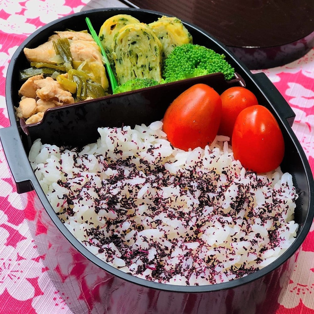 Tamago yaki and steamed chicken dish with rice in the Mokume Koban bento box