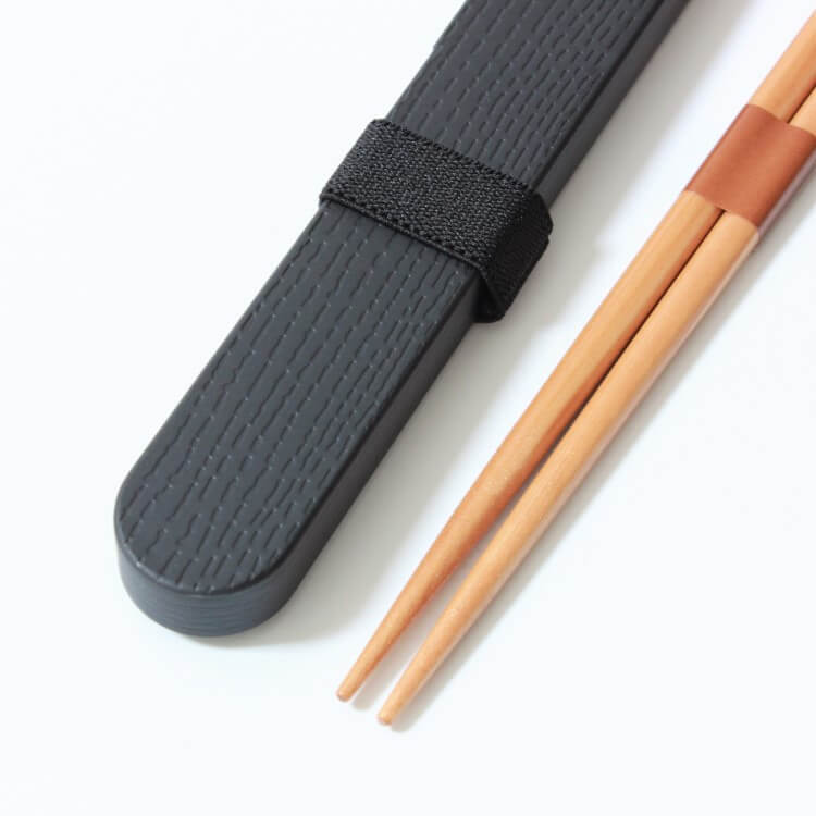close up shot showing surface of case and chopsticks tips