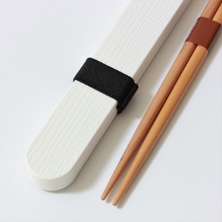Close up shot showing the surface of the case and tips of chopsticks