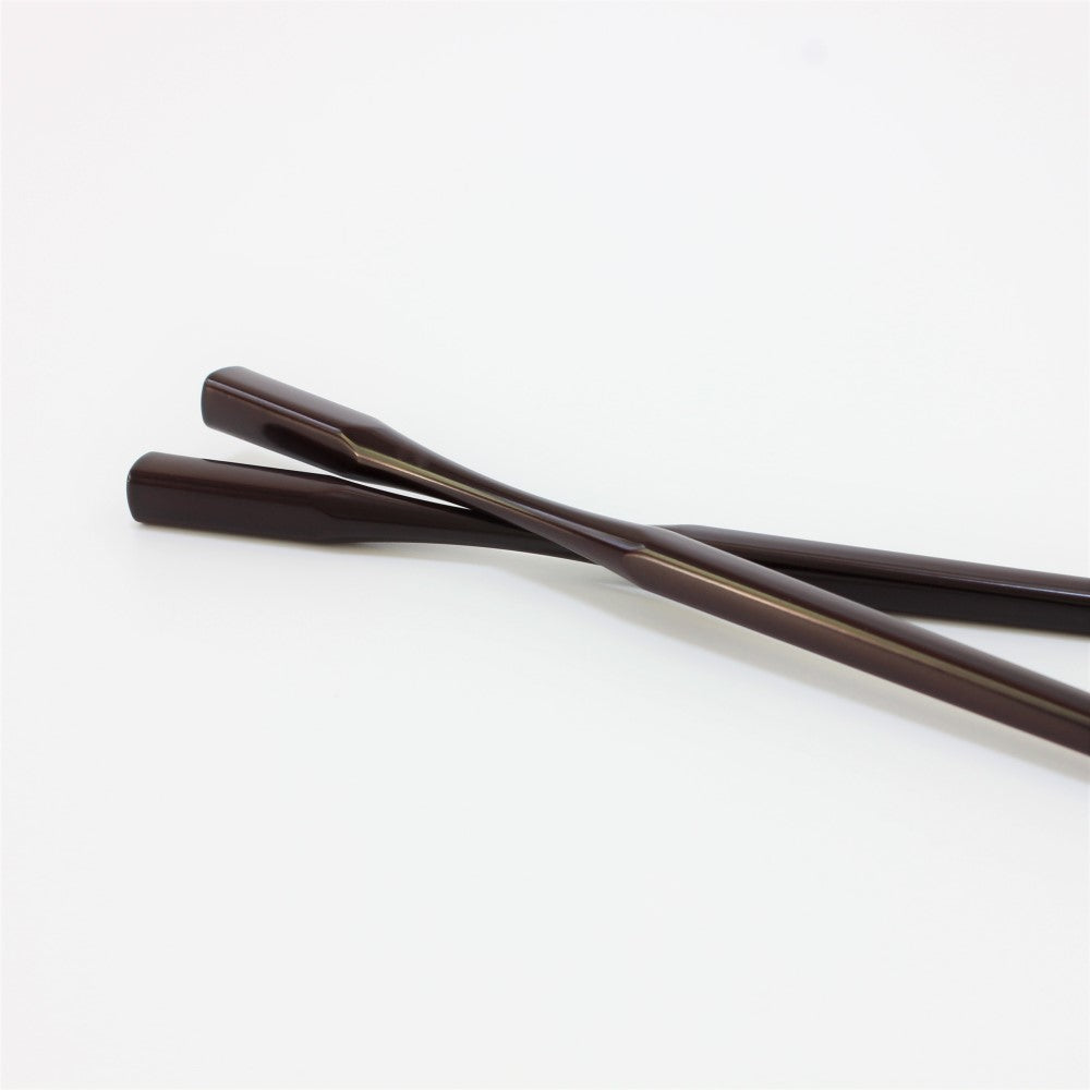 Majime Life teak grain colour Ohashi Collection chopsticks showing curved necks sitting on top of each other.