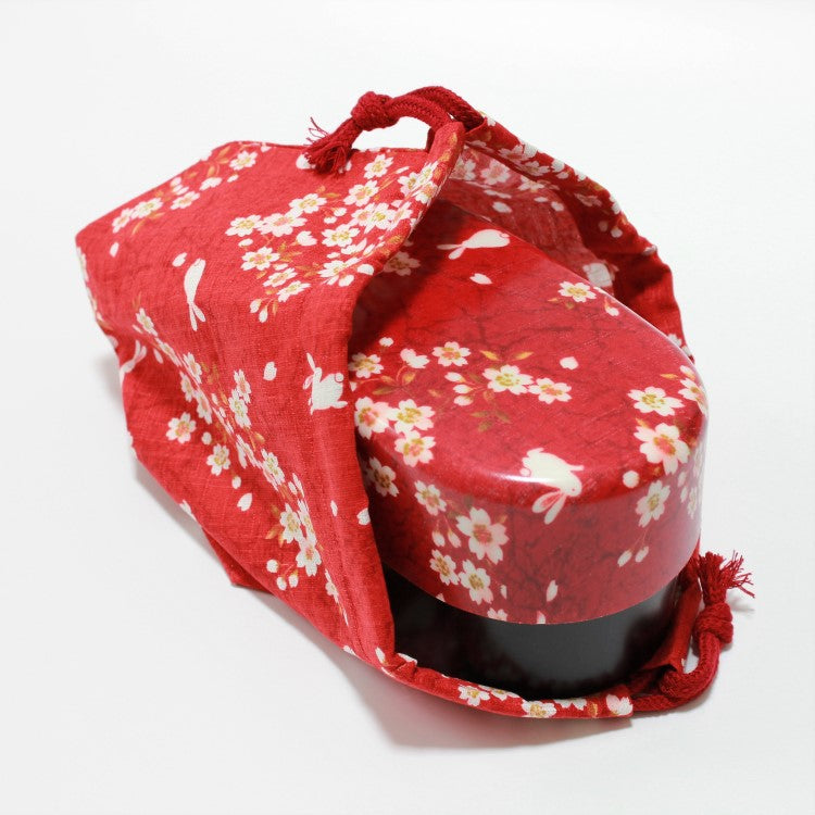 red bento box inside bento lunch bag