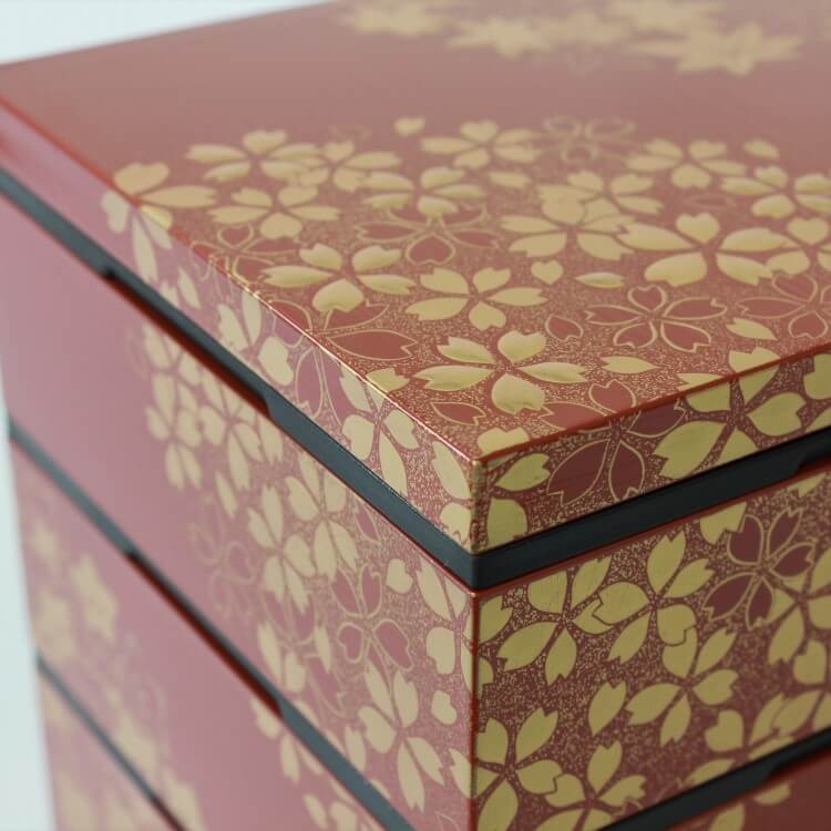 close up shot showing sakura motifs on the surface of bento box